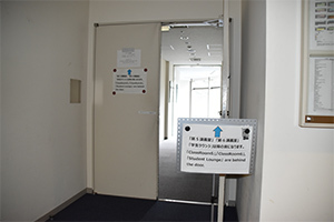 3. Turn left and open the first door where you see on the left with posters.